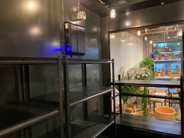 Camelback Flowershop interior showing flower cooler with Airocide air purification system installed